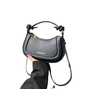 Black saddle bag for women, trendy shoulder crossbody handbag with handle, stylish chic accessory.