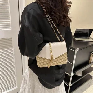 Summer straw woven crossbody bag for women with chain strap and chic white flap design.