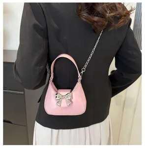 Borsa a mano rosa dolce con fiocco da donna, elegante borsa a tracolla con catena.