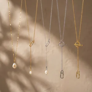 Exquisite vintage metal necklace set featuring elegant pearl pendants and stylish toggle clasps for women.