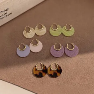 Colorful acetate hoop earrings detail shot, retro style versatile design for women.