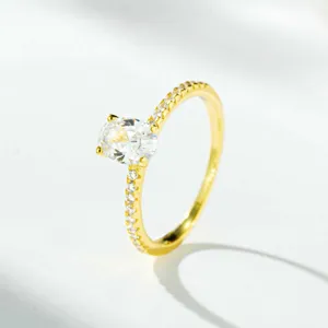 18K gold plated 925 sterling silver oval cut cubic zirconia ring with dainty pave side stones.
