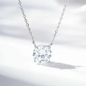 Classic four-prong solitaire diamond pendant necklace, elegant minimalist silver chain.