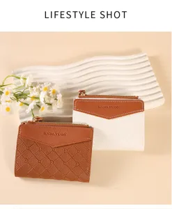 Detail shot of stylish short zipper women wallet with contrast color and quilted pattern design.