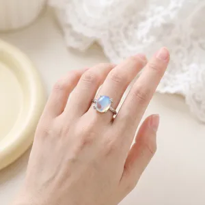 Exquisite minimalist imitation moonstone ring featuring an elegant oval design for women.