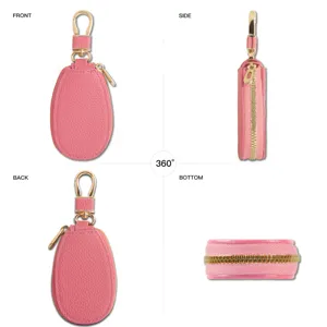 Rosa Mini Leder Autoschluesseltasche Detailansicht mit Reissverschluss und goldenem Haken.