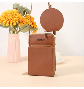 Borsa a tracolla per cellulare monocolore in due pezzi con cinghia e piccola tasca rotonda.