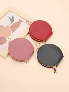 Portable mini round zipper coin purse and earphone case set in three chic colors.