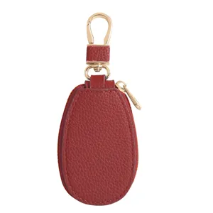 Mini rotes Leder Auto Schlüsselmäppchen mit Reißverschluss und goldenem Karabiner für Tasche.
