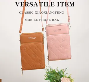 Borsa a tracolla trapuntata da donna per cellulare con cerniere multiple e spallaccio elegante.