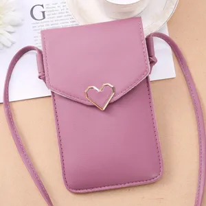 Purple small crossbody phone bag detail, stylish heart metal buckle, PU leather texture.