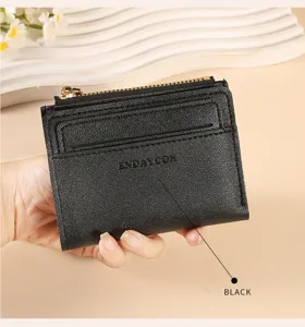 Detailed view of black minimalist short wallet card holder with zip pocket and card slots.