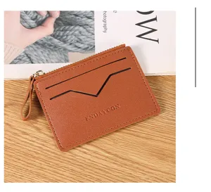 Detail view of brown leather zipper card holder with multi slots and coin pocket design.