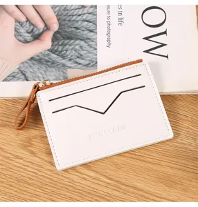 Close-up detail view of white PU leather card holder wallet featuring brown zipper and slots.
