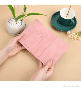 Pink PU leather passport holder travel wallet with card slots and travel document organizer.