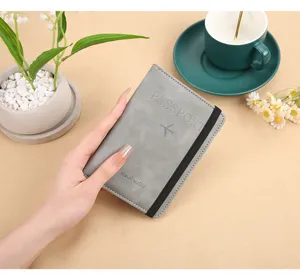 PU leather passport holder with elastic band, travel wallet and document organizer case.