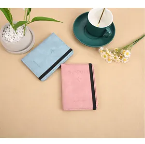 PU leather passport holder with elastic band, RFID blocking travel wallet organizer case.