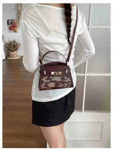 Elegant women shoulder bag with embroidered floral details, stylish vintage handbag for daily wear.