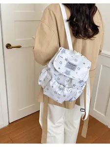 Sac à dos mini mignon avec imprimé d'étoiles pour les voyages et l'utilisation quotidienne.