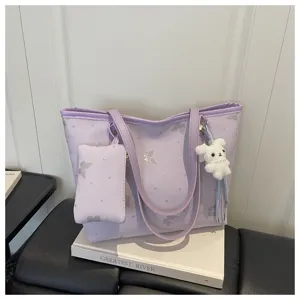 Purple tote bag for women PU leather shoulder handbag with cute bunny charm and small pouch.