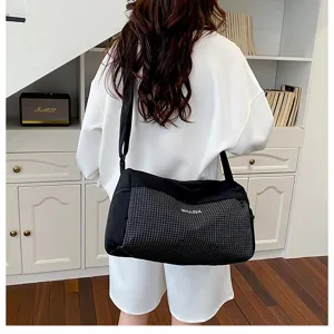 Casual large capacity travel duffel bag for women, lightweight gym and weekend luggage.