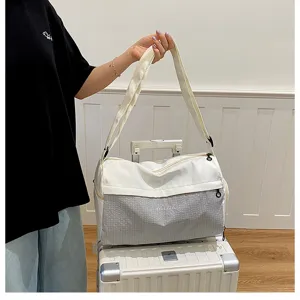 Large capacity travel duffel bag for women, lightweight short trip luggage bag with handles.