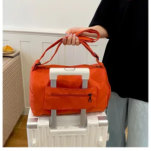 Orange travel duffel bag, large capacity gym bag with luggage sleeve for short trips.