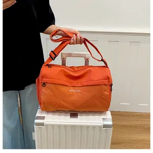 Large capacity travel duffel bag for women, lightweight short trip weekender bag with durable handles.
