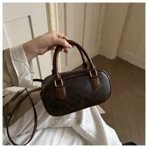 Retro brown monogram shoulder bag, stylish bowling pillow handbag for women winter daily use.