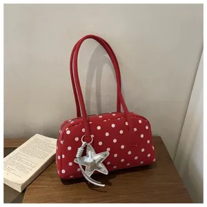 Red polka dot pillow shoulder bag with silver star charm, cute niche design for daily use.