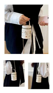 Cute mini white bucket bag with bear print and chain strap, stylish kids shoulder bag.
