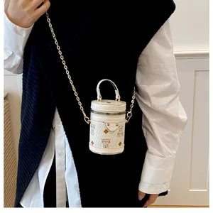 Cute mini bucket bag with chain strap, stylish kids shoulder bag and fashionable handbag.