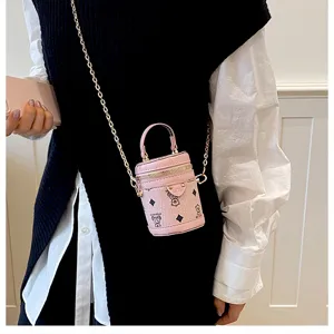 Mini cute pink bucket bag with chain strap, stylish leather crossbody bag for daily wear.