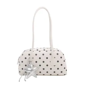 White polka dot pillow shoulder bag for women, cute underarm handbag with star charm.