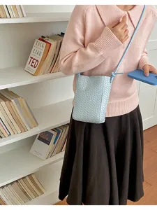 Woven crossbody phone bag for women, stylish PU leather shoulder bag with chic design for daily use.