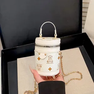 Mini white bucket bag with cute bear print, elegant chain shoulder handbag for kids and women.