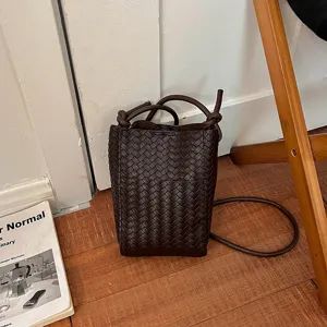 Woven leather crossbody bag for women, stylish brown shoulder bucket bag, trendy daily PU purse.