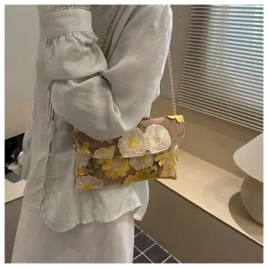 Stylish embroidered floral chain shoulder bag, ideal for summer daily wear and chic outfits.