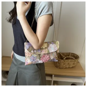 Floral embroidered chain shoulder bag, detailed view of colorful flower embroidery design.