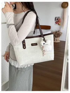 Fashion casual tote bag for women, vintage minimalist shoulder bag with cute plush bunny charm.