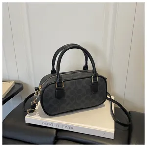 Vintage black monogram bowling bag, classic retro top handle pillow bag with shoulder strap.