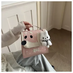 Pink cute puppy design handbag with star pattern and soft plush pendant for daily sweet style.