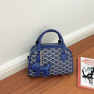 Blue PU leather handbag with geometric pattern and cute dog charm for women daily fashion