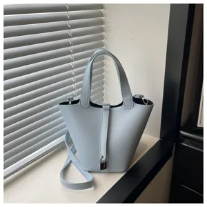 Light blue bucket bag women stylish solid color shoulder bag detail view fashion design