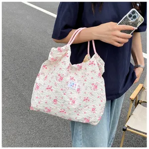 Floral pleated tote bag for women, casual canvas shoulder bag with pink straps and drawstring.