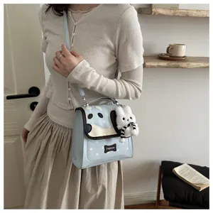 Cute cartoon dog design crossbody bag with plush charm and star print for sweet daily style.