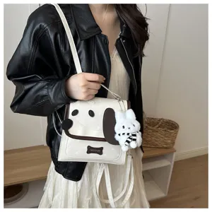 Cute cartoon dog PU leather shoulder handbag with sweet star print and plush bunny pendant.