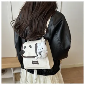 Detail view of the cute cartoon puppy backpack with plush rabbit pendant and star prints.