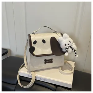 Cute cartoon puppy design PU leather crossbody bag with plush bunny keychain and star print.
