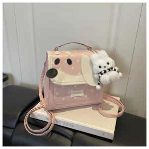 Detailed view of the pink cartoon dog print backpack with cute rabbit pendant for daily style.